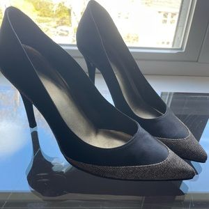 Classic shape, Stuart Weitzman, black pumps with metallic accent.